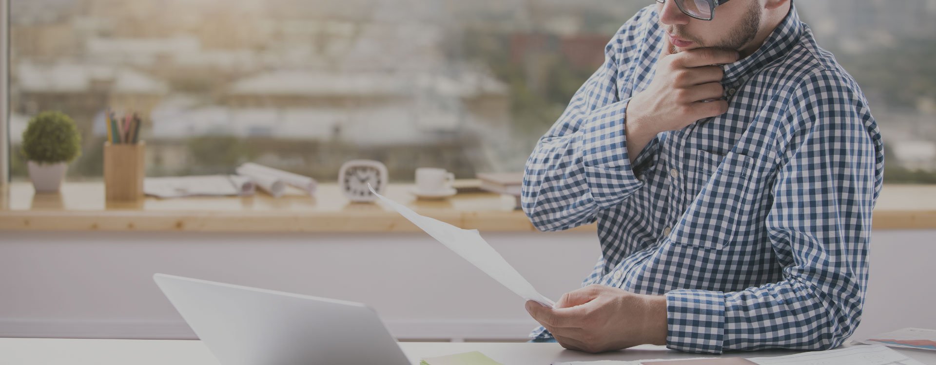 Person working with a laptop for the Notice Ninja resources page